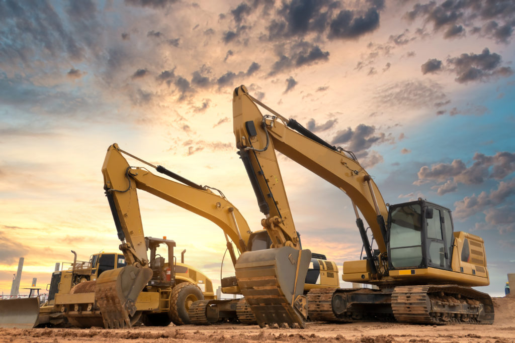 Excavator operating on a job site